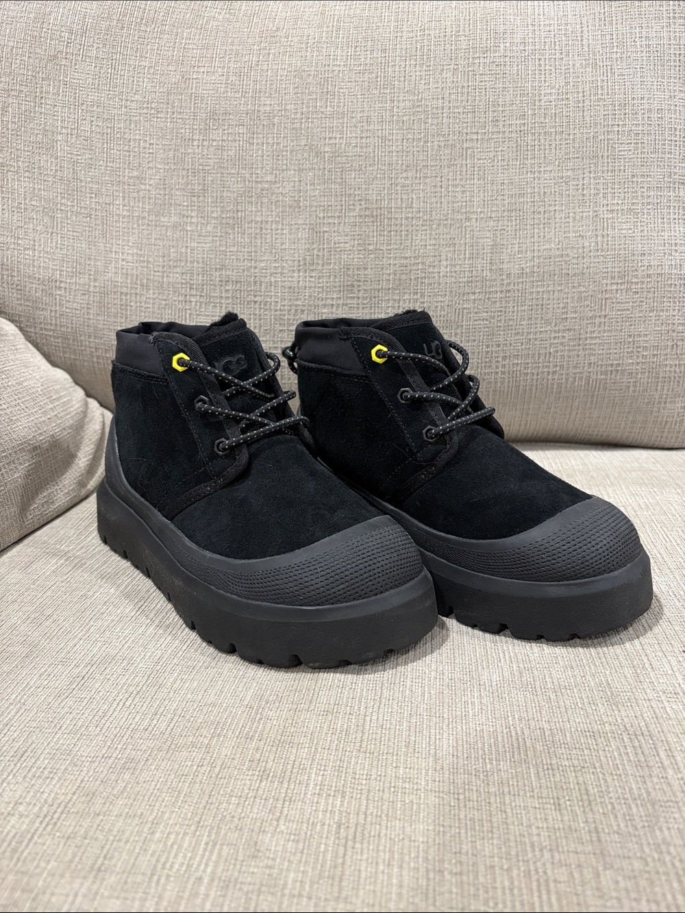 UGG (size: Men 4/ Women 5.5) Black Suede Lug Ankle Boots with Yellow Eyelet
